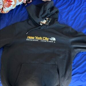 The North Face Black Hoodie with Yellow New York City Logo